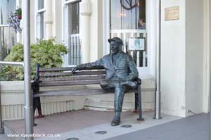 Statue of Sir Norman Wisdom seated outside the Sefton Hotel in Douglas, Isle of Man